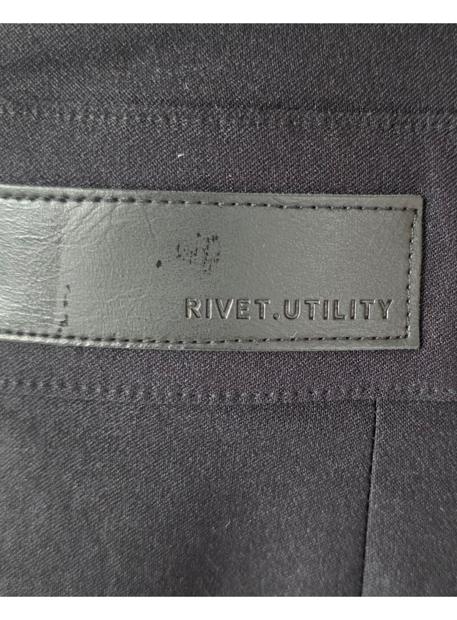 Rivet Utility v hals open rug mouwloze jumpsuit stretch zwart S tweedehands dames designer