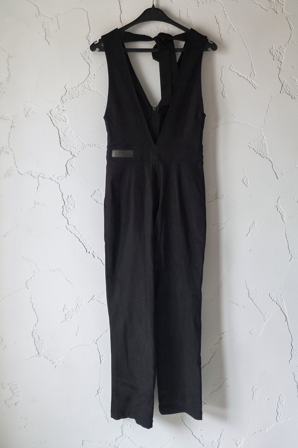 Rivet Utility v hals open rug mouwloze jumpsuit stretch zwart S tweedehands dames designer